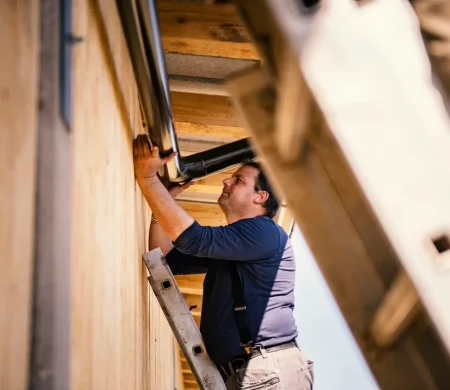 installing-rain-gutters-GettyImages-1312413289